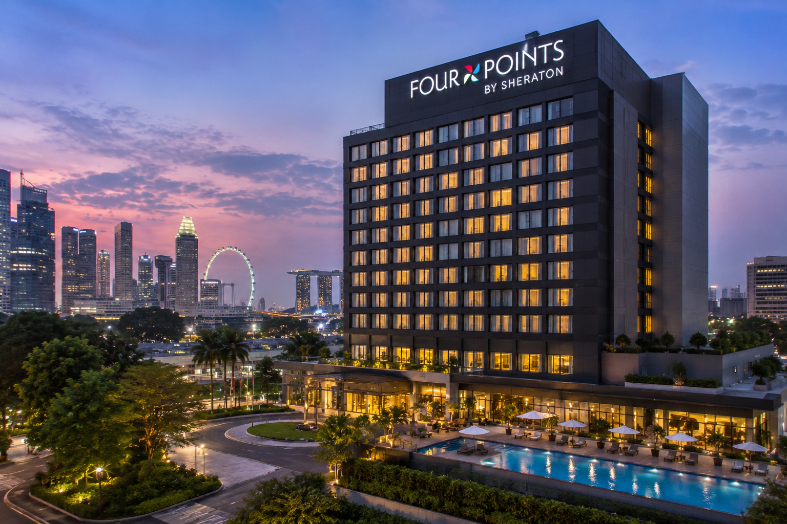 Four Points by Sheraton Singapore, Riverview overlooking the Singapore skyline at dusk.